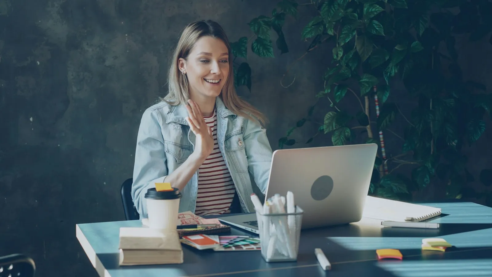 A woman on a video call with her laptop at home